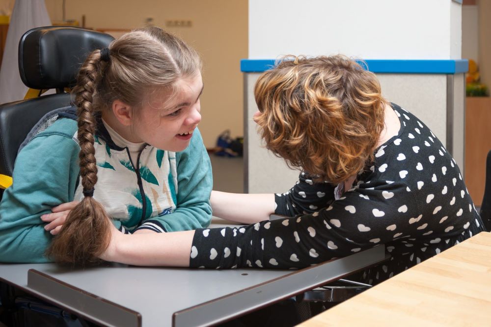 A special needs carer with a child.